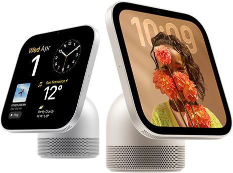 Apple HomeView, two devices: silver colour, first screen shows date, clock, and weather, starlight colour (pale gold), second screen shows time over a wallpaper of a person holding flowers