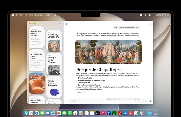 14 Zoll MacBook Pro in Space Schwarz, das Display zeigt die Siri App mit einer aktiven Siri AI Unterhaltung und vorherigen Unterhaltungen in der Seitenleiste.