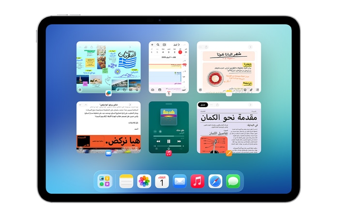 iPad في الوضع الأفقي، وشاشته تعرض ست نوافذ مفتوحة في صفين، بما في ذلك تطبيق التقويم وتطبيق الملاحظات وApple Music وSafari‏