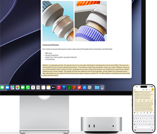 Mac mini front, tucked under Studio Display, an iPhone sits to the right of the device and the display, text selected with cut, copy, paste, and AutoFill commands above on iPhone matches highlighted text on display, showcasing Universal Clipboard