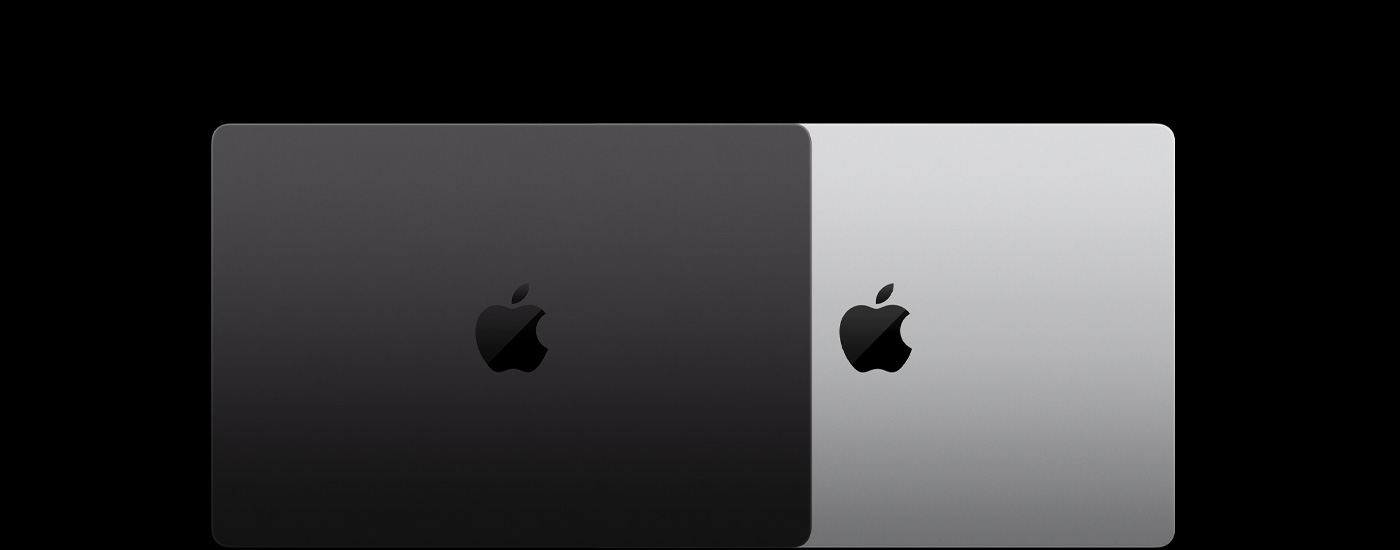 Näkymä ylhäältäpäin kahdesta suljetusta Mac-kannettavasta, toinen on toisen päällä.