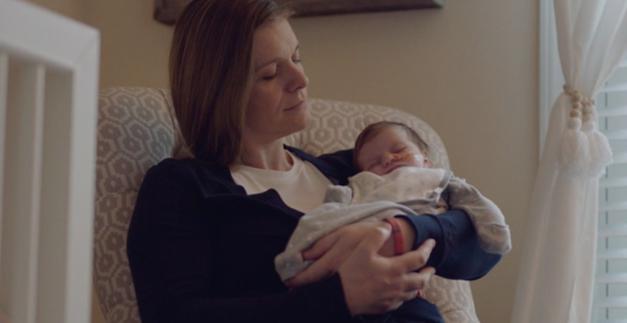 A mother caring for her baby.