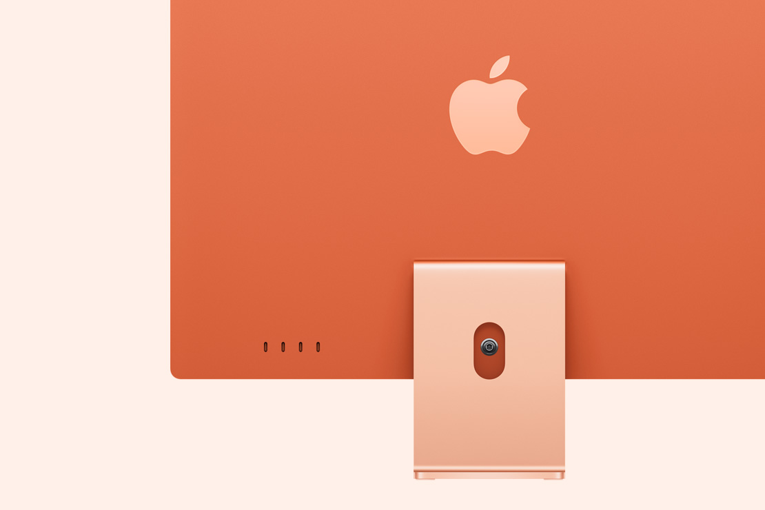 Rear view of an orange iMac, highlighting 4 USB-C ports
