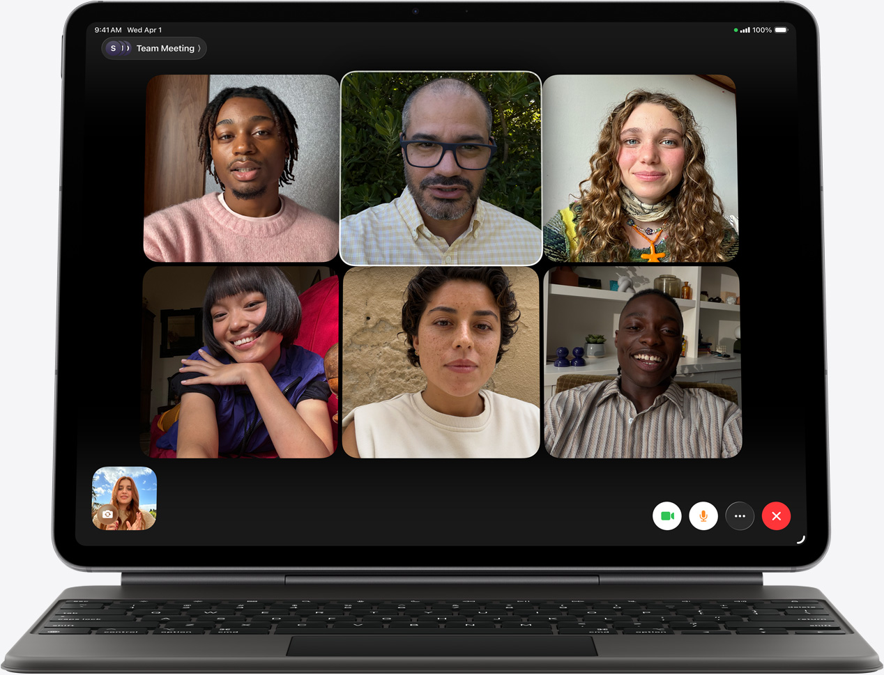 iPad Air, front exterior, Magic Keyboard, black color, FaceTime call on the screen, multiple participants visible