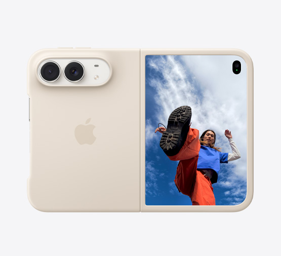 iPhone Duo, Star White colour, propped up with the Navy Blue Folio with Kickstand, fully opened horizontally, back exterior featuring the 48MP Dual Fusion rear cameras, two lenses