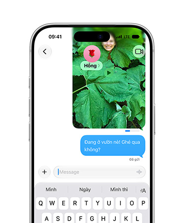 Screen shows a photo of a person posing in a leafy plant being sent in Messages with a send indicator status bar showing the send progress, sent message under image, text reads: At the garden! come through?